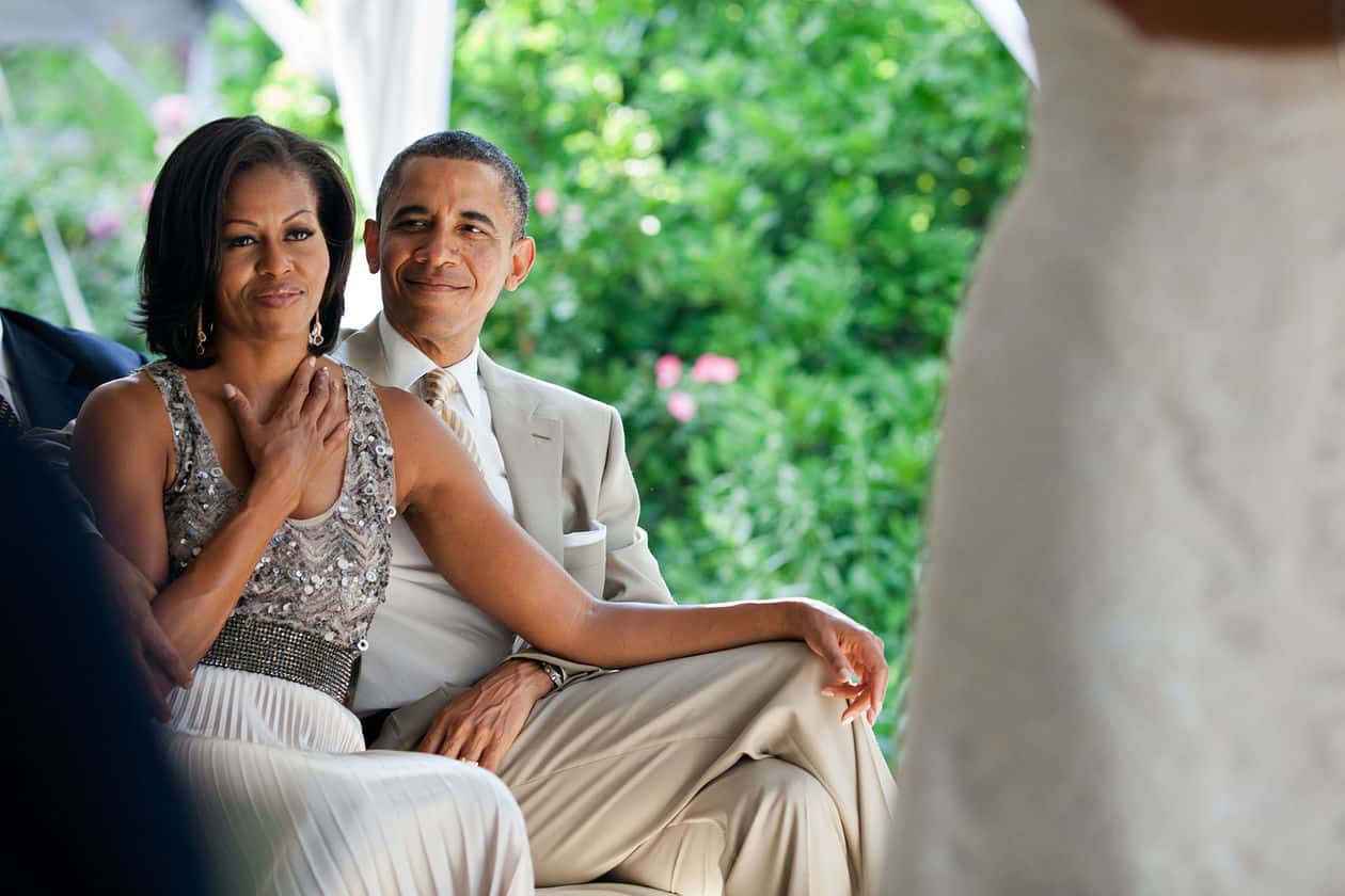 Obamas Ink Deal With Netflix To Produce Series, Documentaries, And Feature Films 1 Barack and Michelle Obama watching a wedding