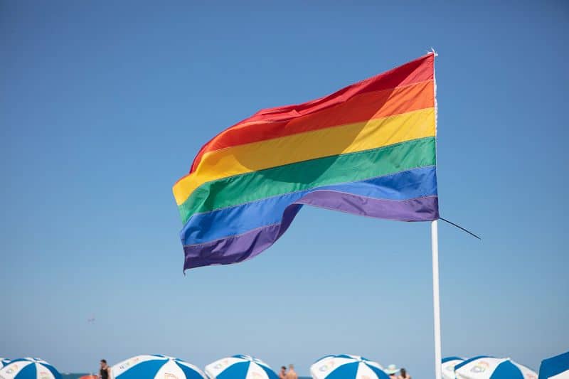 Pride flags along Miami's 12th Street Beach, known as the gay beach, and a hub for the Miami LGBTQ+ community. Photo courtesy of the  GMCVB – http://MiamiandBeaches.com.